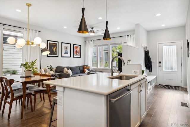 1702 W 66th Ave, Denver, CO 80221 - kitchen featuring visible vents, stainless steel dishwasher, a sink, light countertops, and recessed lighting