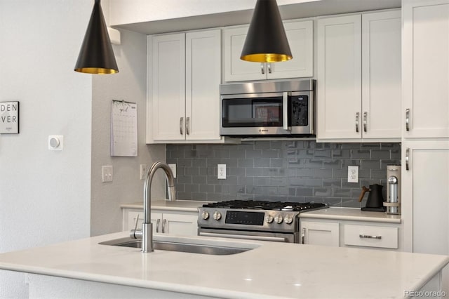 1702 W 66th Ave, Denver, CO 80221 - kitchen with a sink, appliances with stainless steel finishes, and light countertops