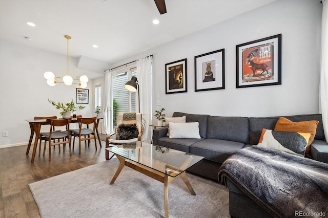 1702 W 66th Ave, Denver, CO 80221 - living room with recessed lighting, baseboards, wood finished floors, and ceiling fan with notable chandelier
