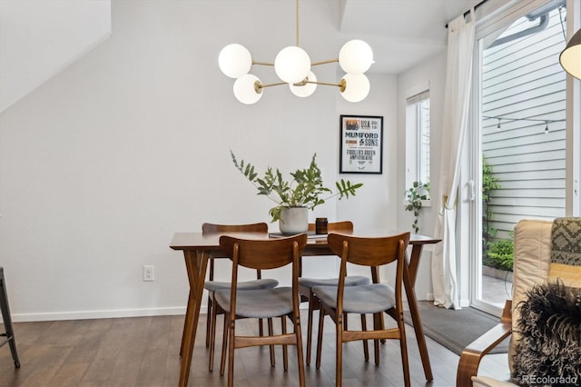 1702 W 66th Ave, Denver, CO 80221 - dining space with baseboards, an inviting chandelier, and dark wood-style floors