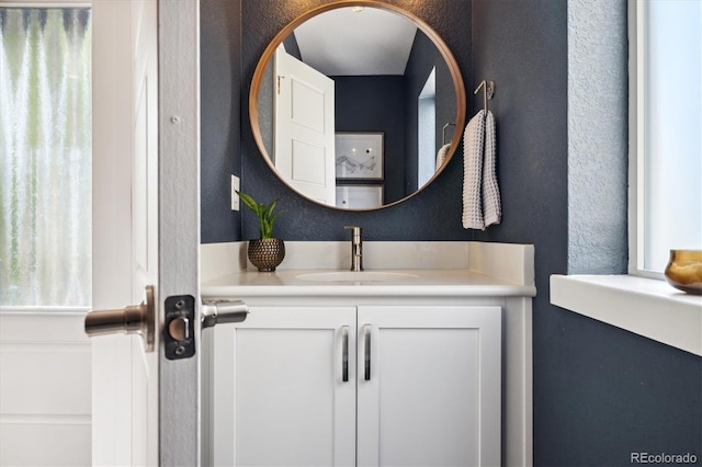 1702 W 66th Ave, Denver, CO 80221 - bathroom featuring a textured wall and vanity