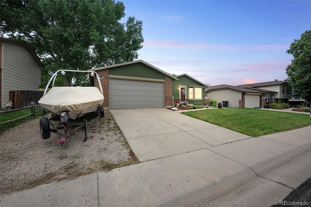 10462 Hoyt St, Westminster, CO 80021 - view of front facade with brick siding, concrete driveway, and a garage