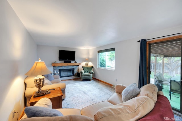 10462 Hoyt St, Westminster, CO 80021 - living area featuring a stone fireplace and wood finished floors
