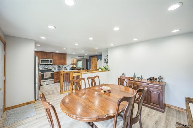 10462 Hoyt St, Westminster, CO 80021 - dining area with light wood-style flooring and recessed lighting
