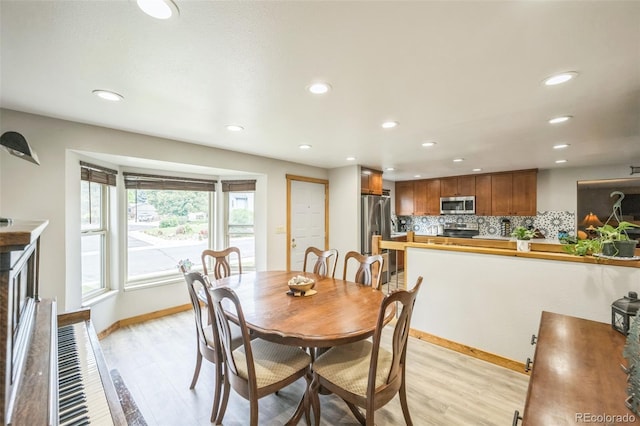 10462 Hoyt St, Westminster, CO 80021 - dining area featuring light wood-style floors and recessed lighting