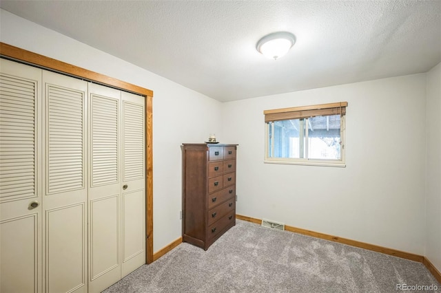 10462 Hoyt St, Westminster, CO 80021 - bedroom with a closet, carpet flooring, and a textured ceiling