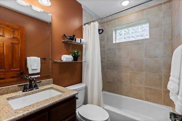 bathroom with toilet, shower / tub combo with curtain, and vanity