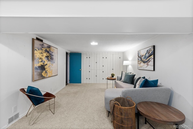 living area with carpet floors and baseboards