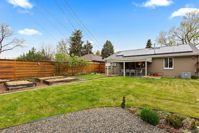view of yard with a garden, a patio, and cooling unit
