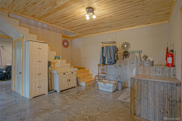 misc room with concrete floors and wooden ceiling