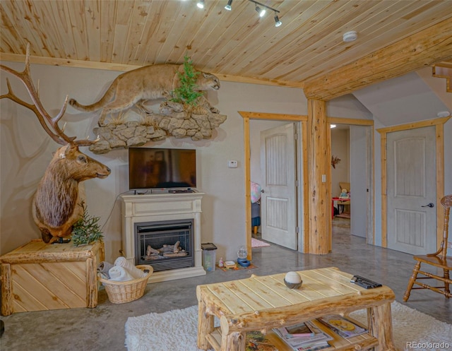 living room with concrete floors, track lighting, and wooden ceiling