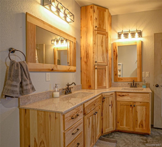 bathroom featuring double vanity