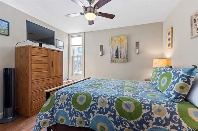 bedroom with ceiling fan and light wood-type flooring