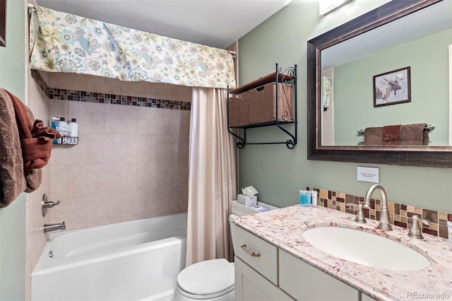 full bathroom featuring toilet, vanity, decorative backsplash, and shower / tub combo