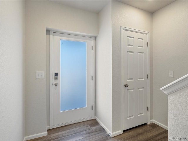 entryway with hardwood / wood-style flooring