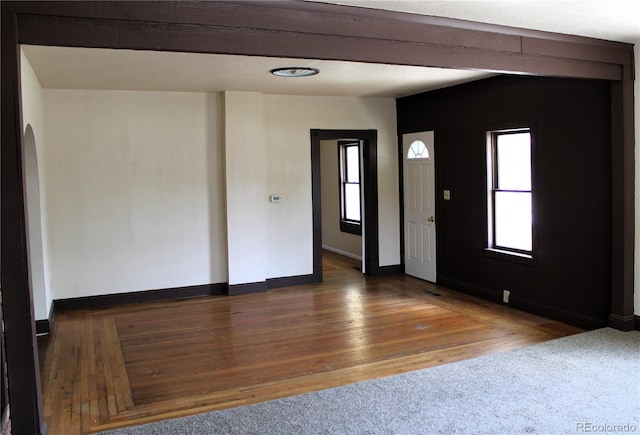 unfurnished room with dark hardwood / wood-style floors