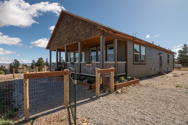 526 Wagon Wheel Rd, Hartsel, CO 80449 - view of property exterior with a garden and covered porch