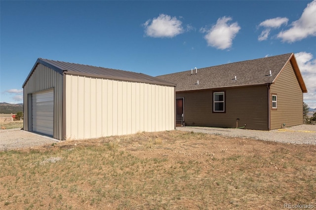 526 Wagon Wheel Rd, Hartsel, CO 80449 - rear view of property featuring an outbuilding, driveway, and a garage