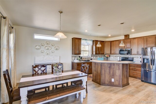 526 Wagon Wheel Rd, Hartsel, CO 80449 - kitchen featuring appliances with stainless steel finishes, backsplash, a sink, light countertops, and recessed lighting