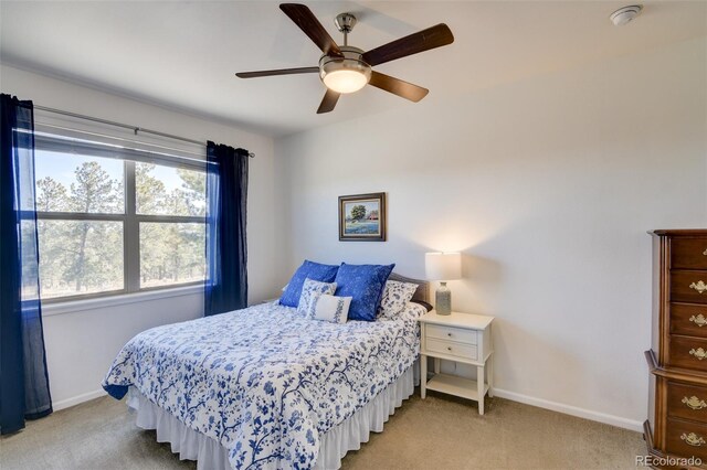 526 Wagon Wheel Rd, Hartsel, CO 80449 - bedroom featuring light carpet, baseboards, and ceiling fan