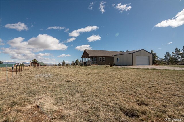 526 Wagon Wheel Rd, Hartsel, CO 80449 - view of grassy yard featuring an outbuilding and an attached garage