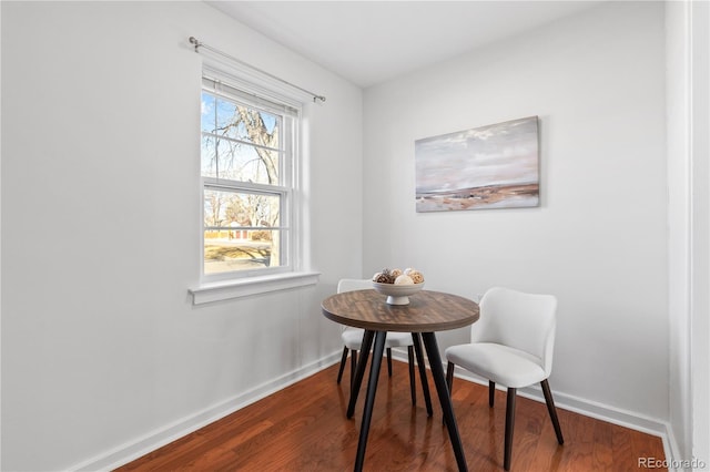 dining room with wood finished floors and baseboards