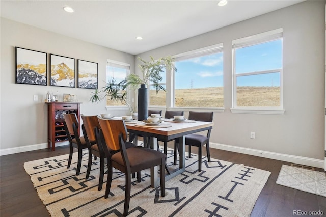 dining area featuring recessed lighting and baseboards