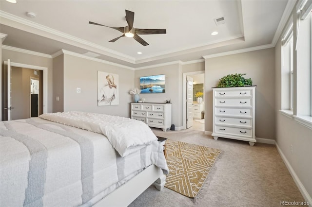 carpeted bedroom with a ceiling fan, baseboards, visible vents, a tray ceiling, and crown molding