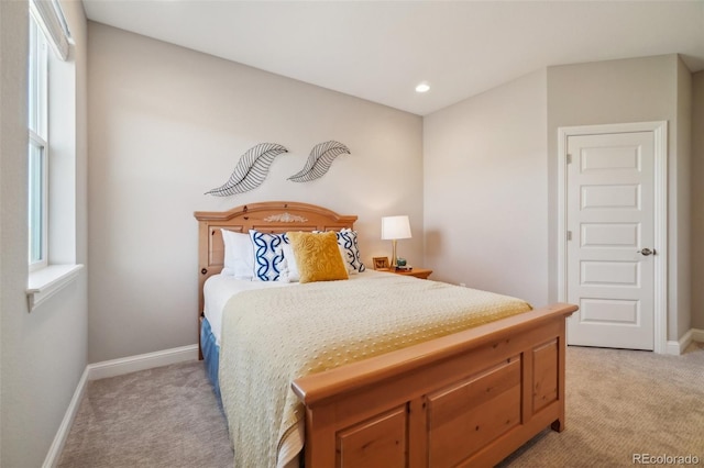 bedroom with recessed lighting, baseboards, and light carpet