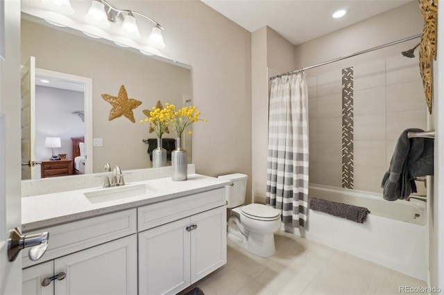 ensuite bathroom featuring shower / bathtub combination with curtain, toilet, ensuite bathroom, tile patterned flooring, and vanity