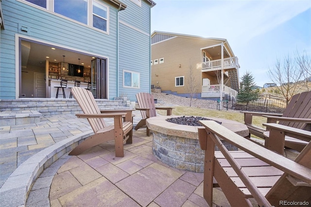 view of patio / terrace featuring a fire pit