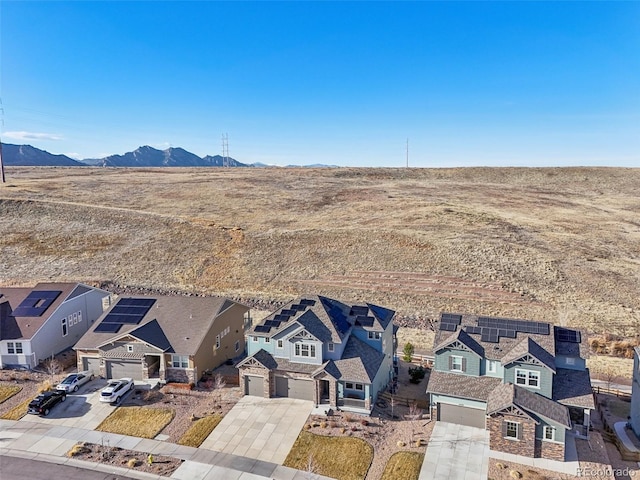 drone / aerial view with a mountain view and a residential view