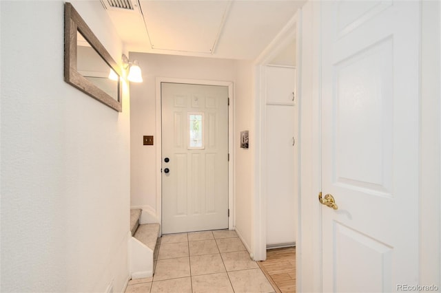 entryway featuring light tile patterned flooring