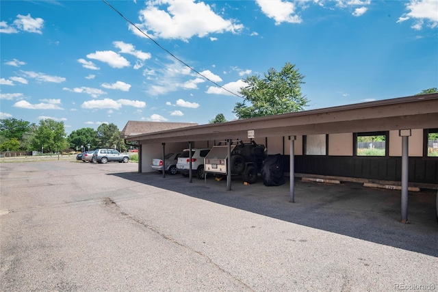 view of parking / parking lot with a carport