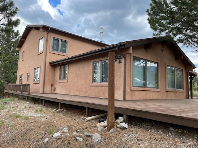 view of home's exterior featuring a deck