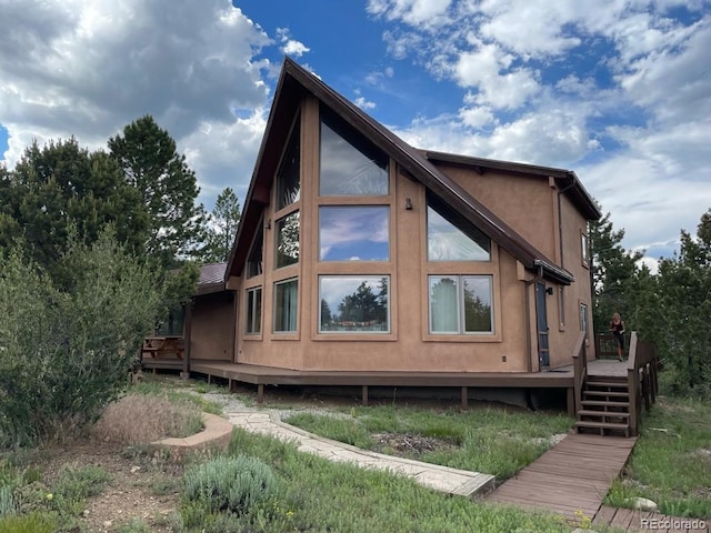 view of property exterior featuring a deck