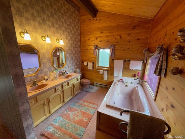 bathroom featuring a washtub, baseboard heating, vanity, lofted ceiling with beams, and toilet