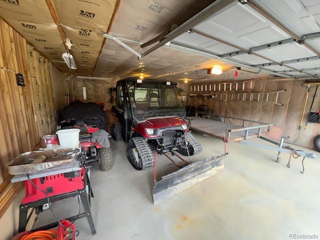 garage featuring wooden walls