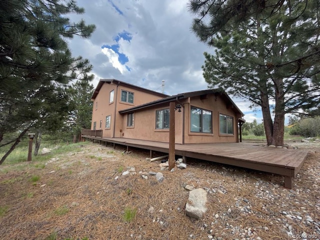 view of side of home featuring a deck