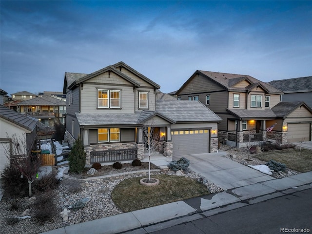 craftsman-style house featuring a garage and a porch