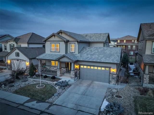 view of front of home featuring a garage and covered porch