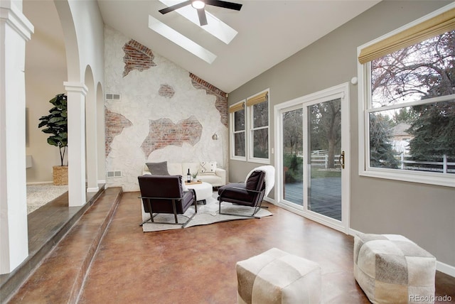 living area featuring arched walkways, decorative columns, visible vents, ceiling fan, and high vaulted ceiling