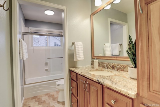 full bathroom with  shower combination, toilet, and vanity