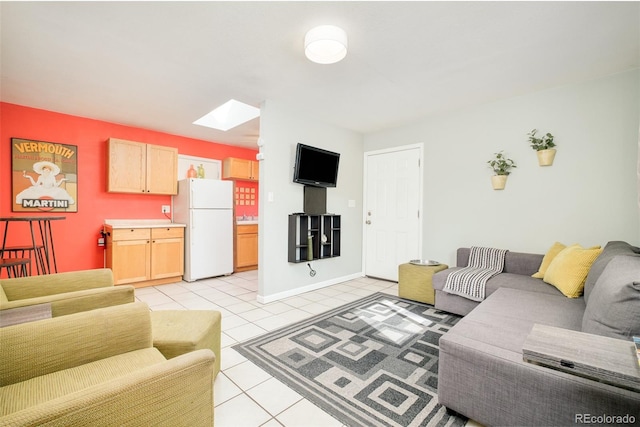 living room featuring light tile patterned floors and a skylight