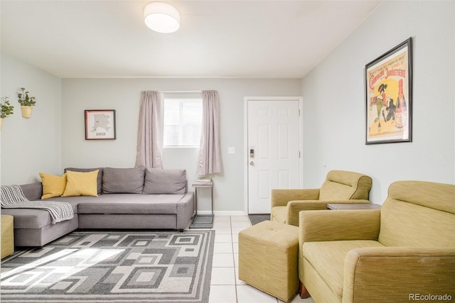 living room with baseboards and light tile patterned floors