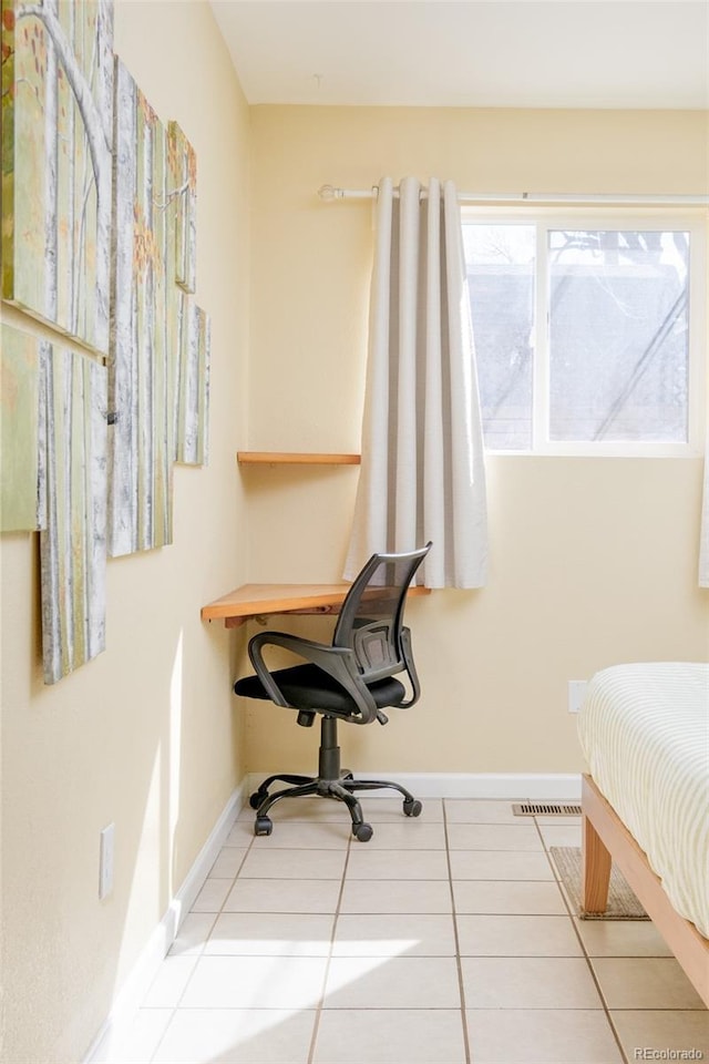 office area with tile patterned flooring and baseboards