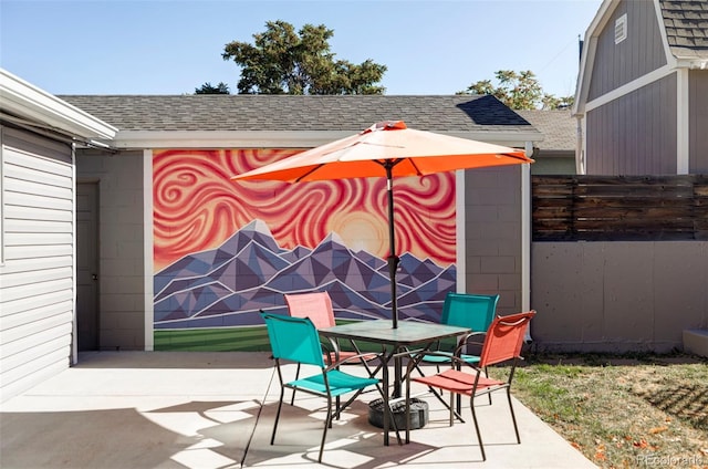 view of patio / terrace with outdoor dining area and fence