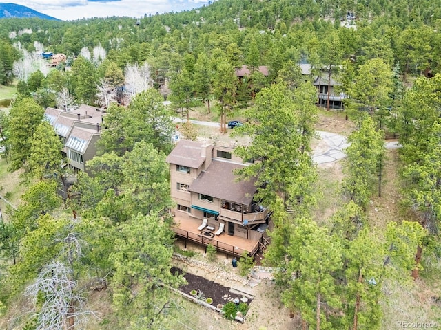 aerial view with a wooded view