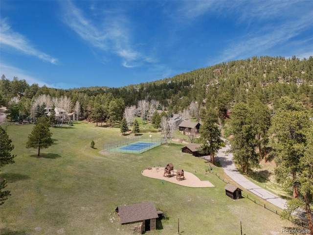 drone / aerial view with a view of trees
