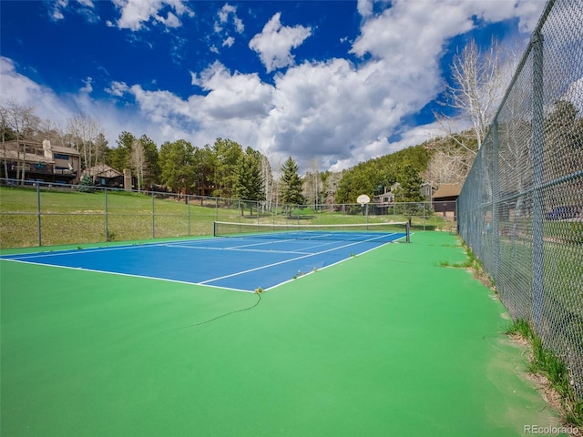 view of sport court with fence